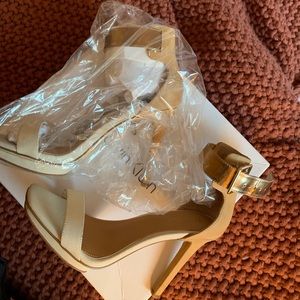 Calvin Klein Nude/White strap heels. Size: 6.5